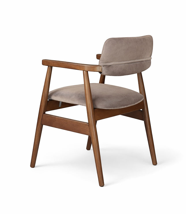 Rear angled view of the Vaya Home Chairo dining chair featuring taupe upholstery, open arm design, and a warm wood frame.