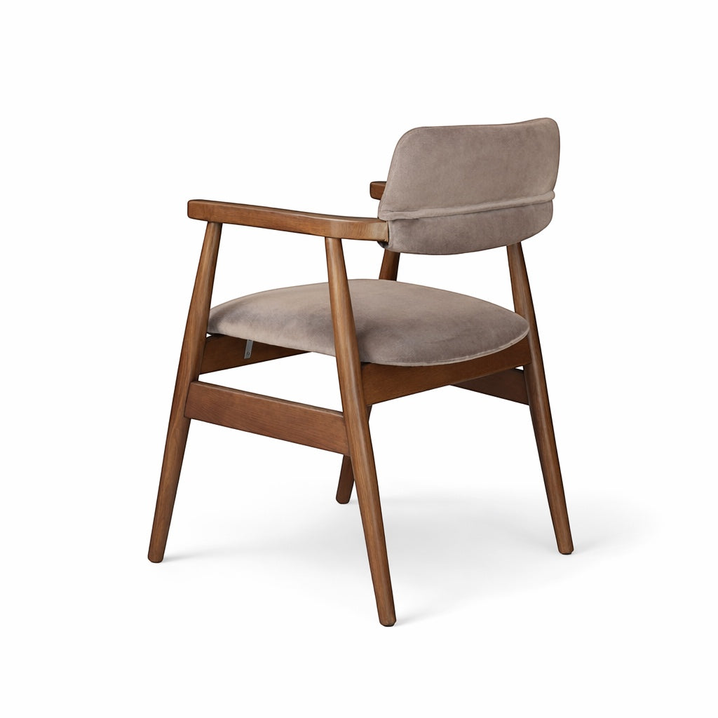 Rear angled view of the Vaya Home Chairo dining chair featuring taupe upholstery, open arm design, and a warm wood frame.