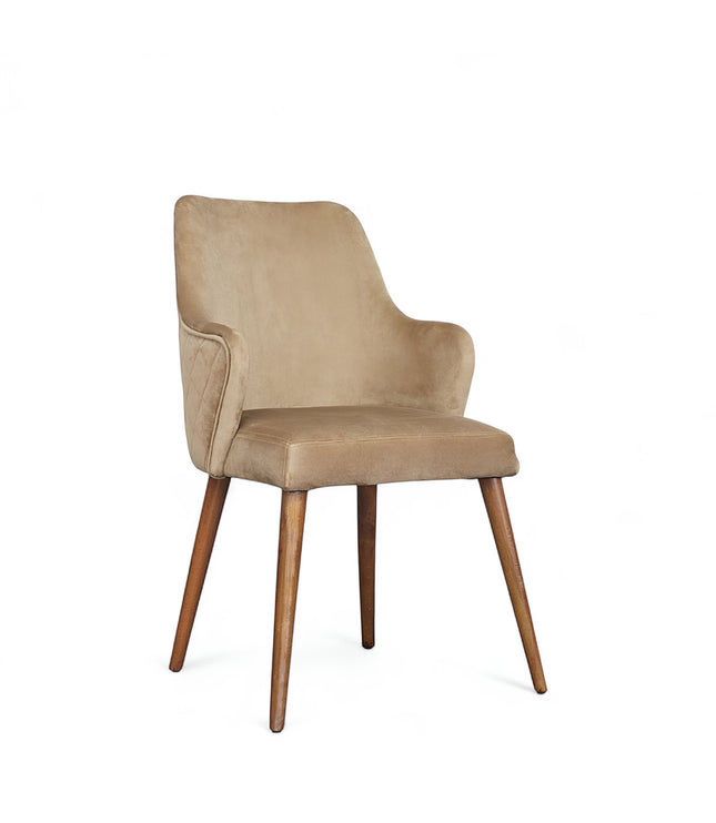 Front angled view of the Vaya Home Ciervo dining chair with beige upholstery, curved arm detail, and tapered wood legs.