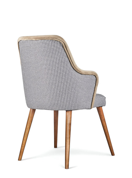 Rear angled view of the Vaya Home Ciervo dining chair featuring houndstooth upholstery and tapered wood legs.