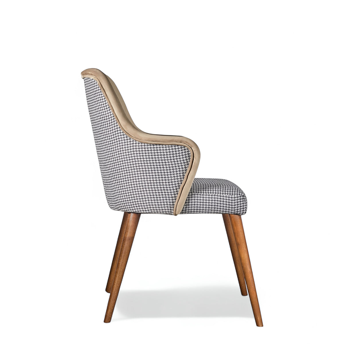 Side view of the Vaya Home Ciervo dining chair with houndstooth upholstery, curved arms, and tapered wood legs.