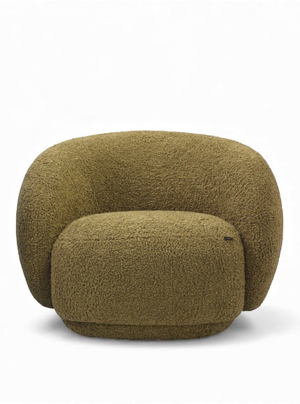 Angled view of the Vaya Home Cloud 2.0 accent chair featuring a rounded sculptural shape and olive green boucle upholstery.