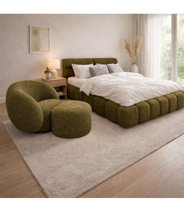 Vaya Home Cloud 2.0 chair with matching ottoman and Forma bed in olive green upholstery, styled in a modern bedroom.