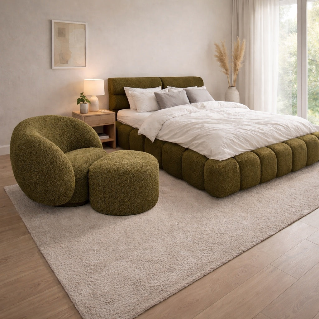 Vaya Home Cloud 2.0 chair with matching ottoman and Forma bed in olive green upholstery, styled in a modern bedroom.