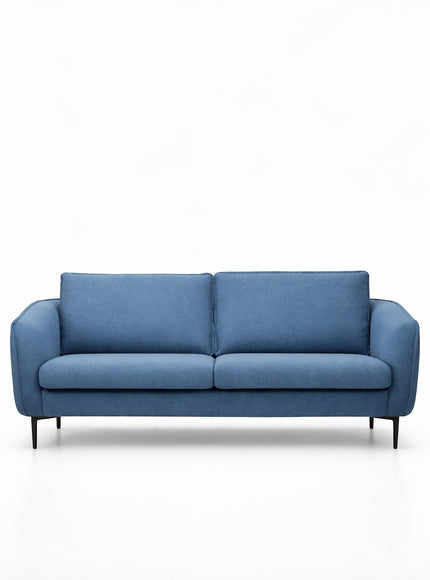 Front view of the Vaya Home Cobalt sofa with blue upholstery, slim arms, two seat cushions, and accent pillows.
