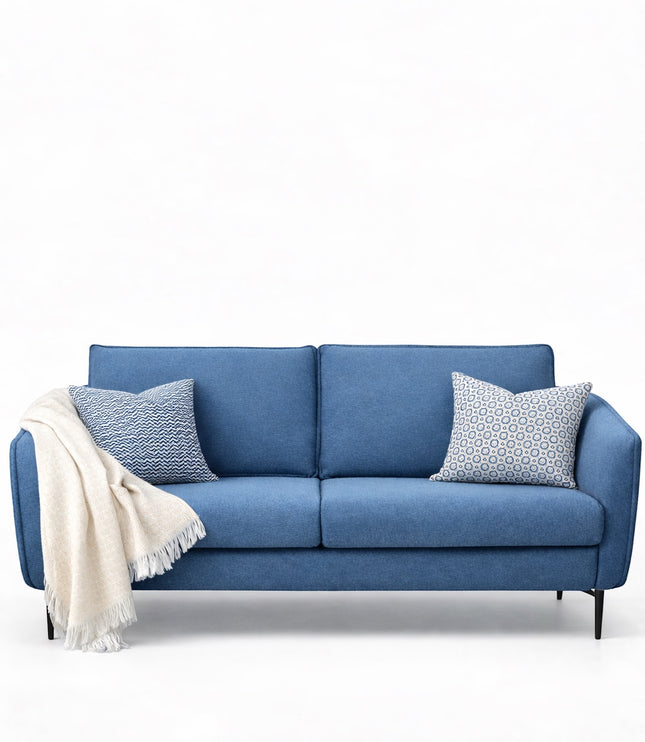 Product view of the Vaya Home Cobalt sofa in blue upholstery with slim arms and a modern low-profile frame.