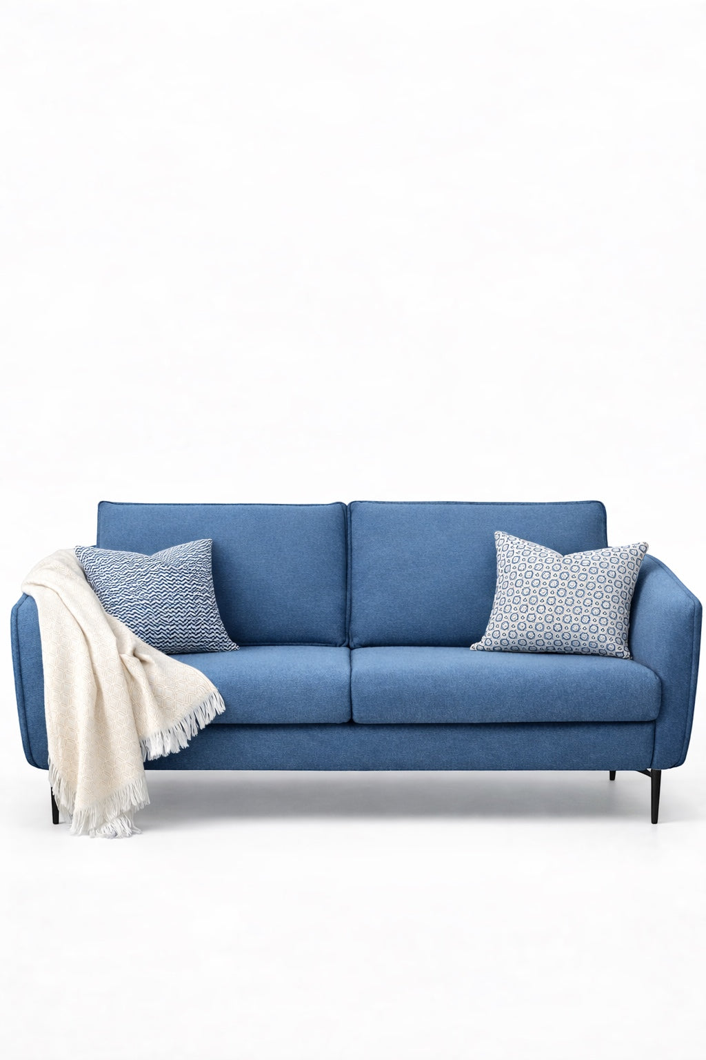Product view of the Vaya Home Cobalt sofa in blue upholstery with slim arms and a modern low-profile frame.