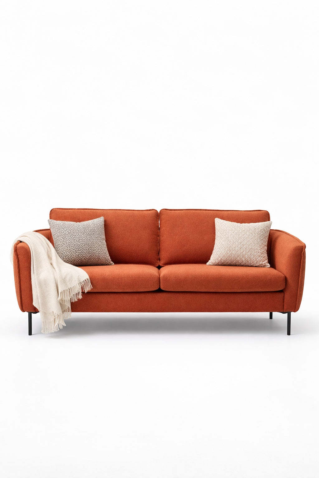 Front view of the Vaya Home Cobalt sofa with orange upholstery, slim arms, two seat cushions, and accent pillows.