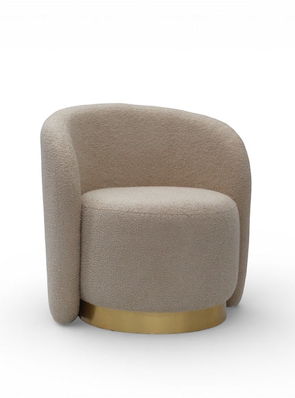 Angled front view of the Vaya Home Cocoon accent chair with beige boucle upholstery, curved silhouette, and gold base detail.