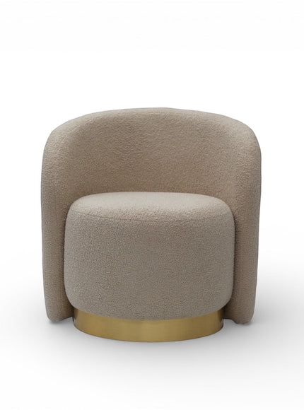 Front view of the Vaya Home Cocoon accent chair with beige boucle upholstery, rounded backrest, and gold base detail.