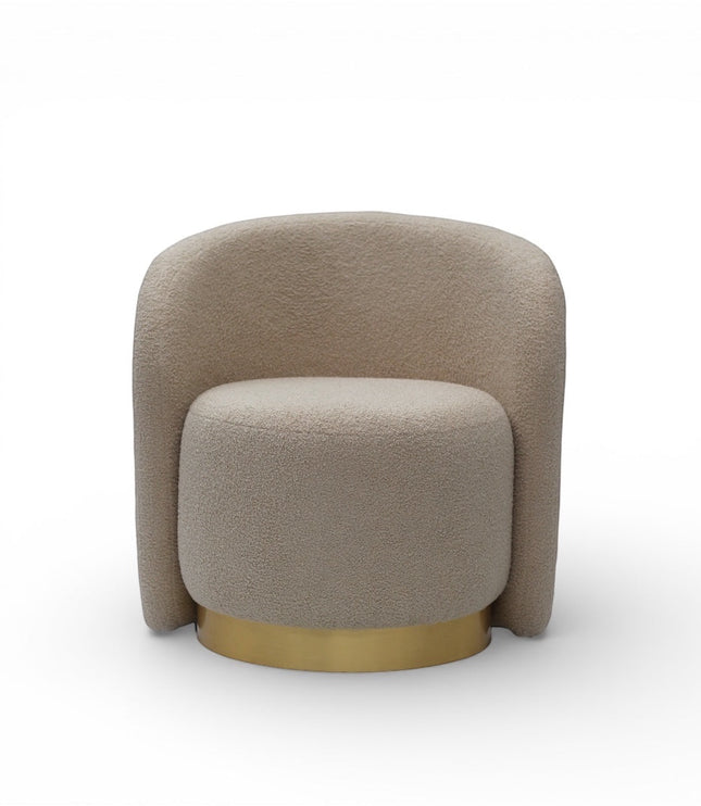 Front view of the Vaya Home Cocoon accent chair with beige boucle upholstery, rounded backrest, and gold base detail.