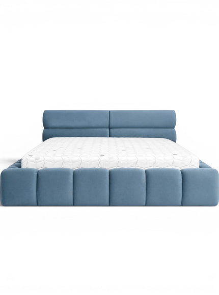 Front view of the Vaya Home Como upholstered platform bed with blue upholstery, a padded headboard, and a channel-detailed base.