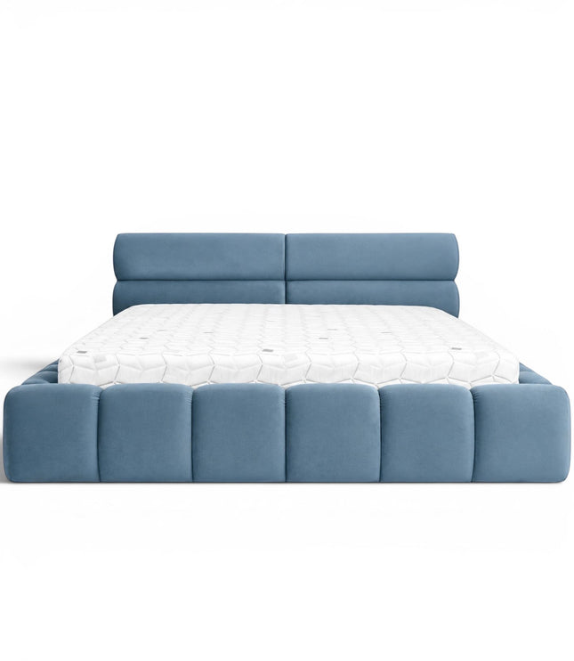 Front view of the Vaya Home Como upholstered platform bed with blue upholstery, a padded headboard, and a channel-detailed base.