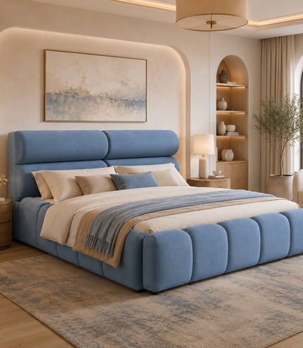 Vaya Home Como upholstered platform bed in blue with a padded headboard and channel-detailed base, styled in a modern bedroom.