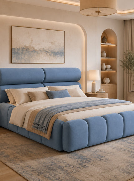 Vaya Home Como upholstered platform bed in blue with a padded headboard and channel-detailed base, styled in a modern bedroom.