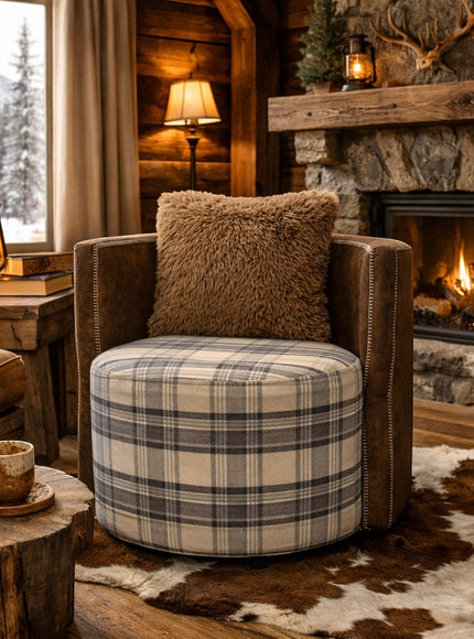 Vaya Home Corvyn armchair with a checkered upholstered seat and brown leather frame, styled in a warm rustic interior.