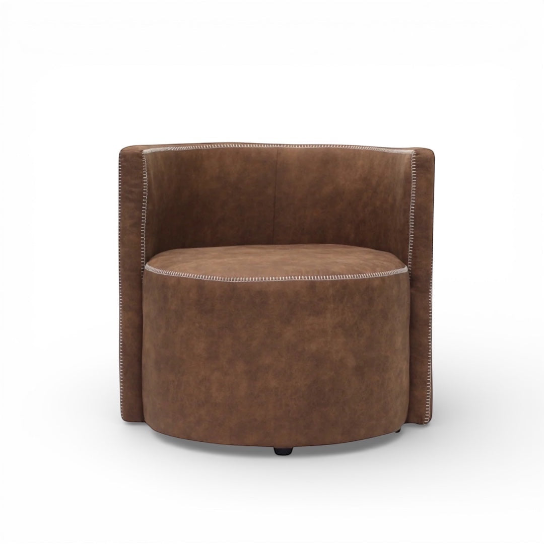 Front view of the Vaya Home Corvyn armchair featuring a rounded seat, curved backrest, and brown leather upholstery.