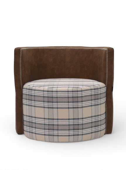 Front view of the Vaya Home Corvyn armchair with a checkered upholstered seat and curved brown leather outer frame.