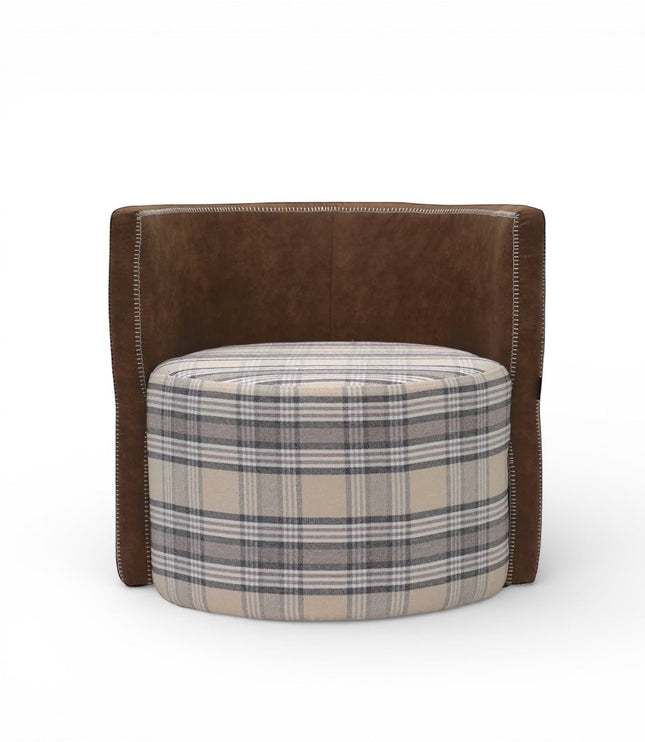 Front view of the Vaya Home Corvyn armchair with a checkered upholstered seat and curved brown leather outer frame.