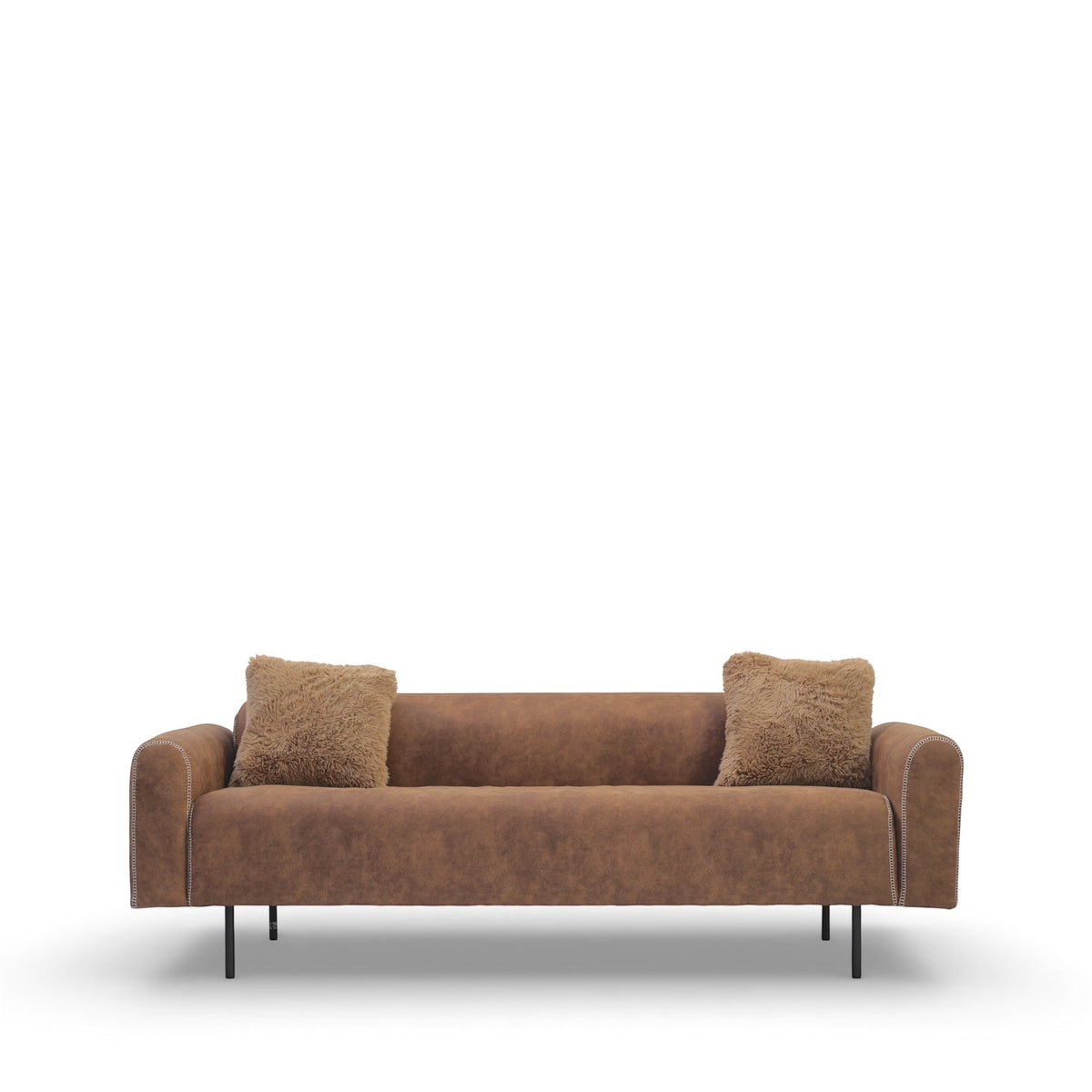 Vaya Home Corvyn brown leather sofa styled in a rustic living room with matching Corvyn armchairs.