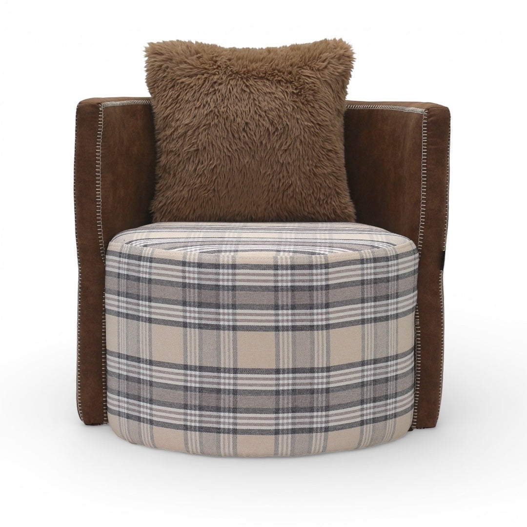 Front view of the Vaya Home Corvyn checkered armchair with a plaid upholstered seat, brown leather sides, and a textured accent cushion.