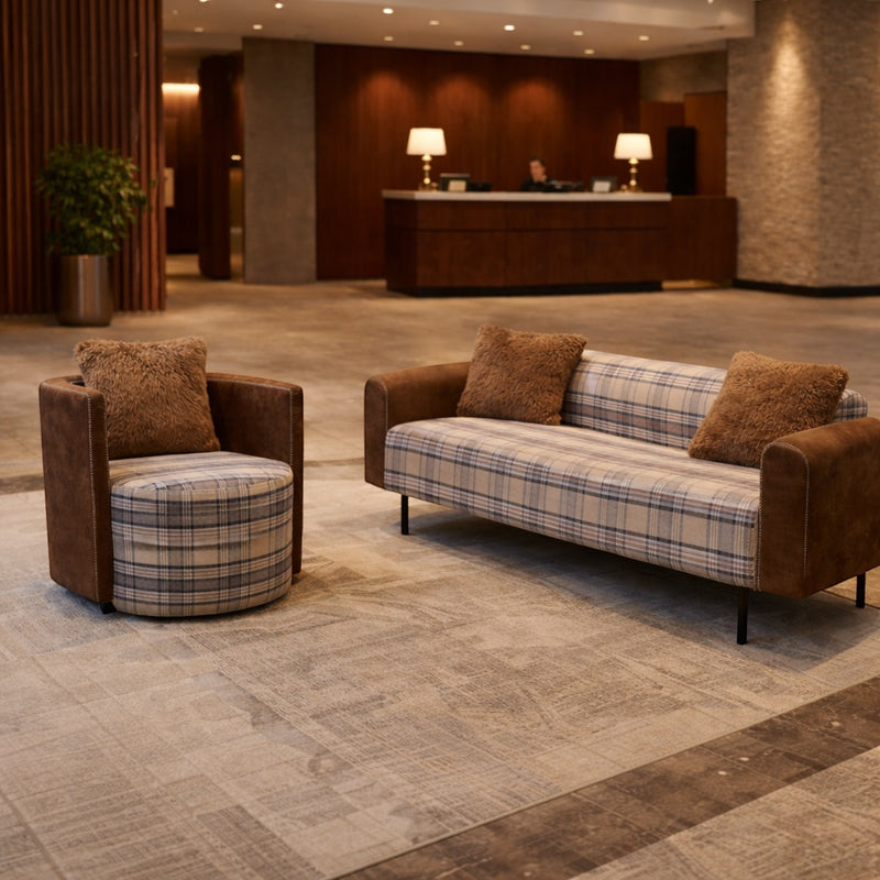 Vaya Home Corvyn checkered armchair styled in a modern lounge setting beside the matching Corvyn sofa.