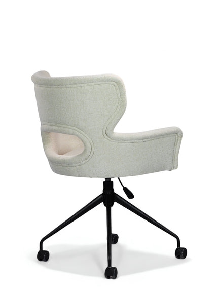 Side angled view of the Vaya Home Crespo swivel office chair with white upholstery, sculpted cutout backrest, and black rolling base.