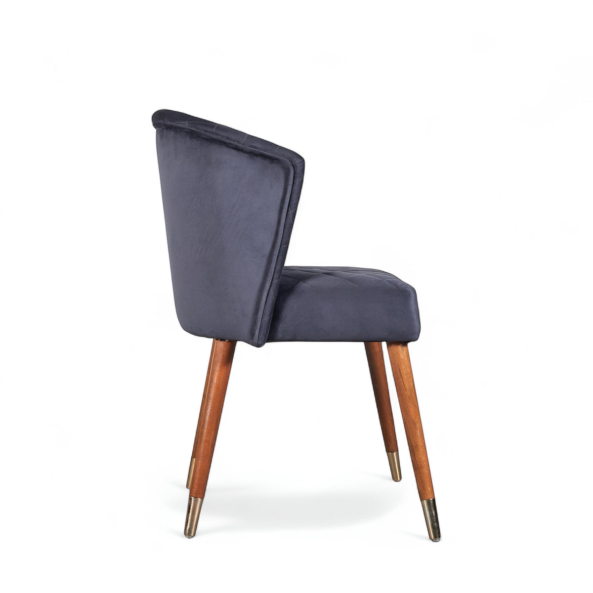 Side view of the Vaya Home Diamante dining chair with dark blue upholstery and tapered wood legs.