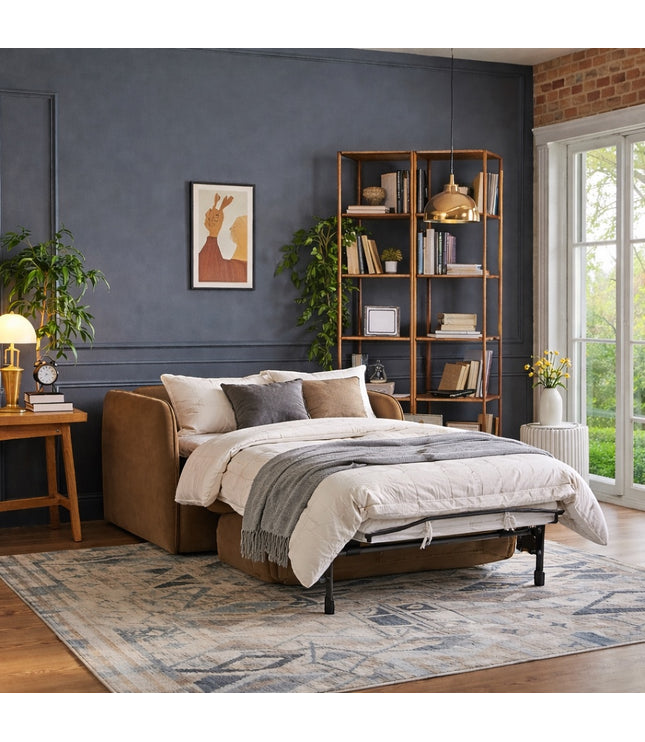 Vaya Home Eira chair bed in beige upholstery, styled in a modern room with the pull-out bed extended.
