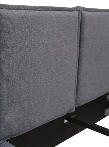 Close-up of the Vaya Home Elmon bed headboard showing grey upholstered panels and stitched edge detailing.