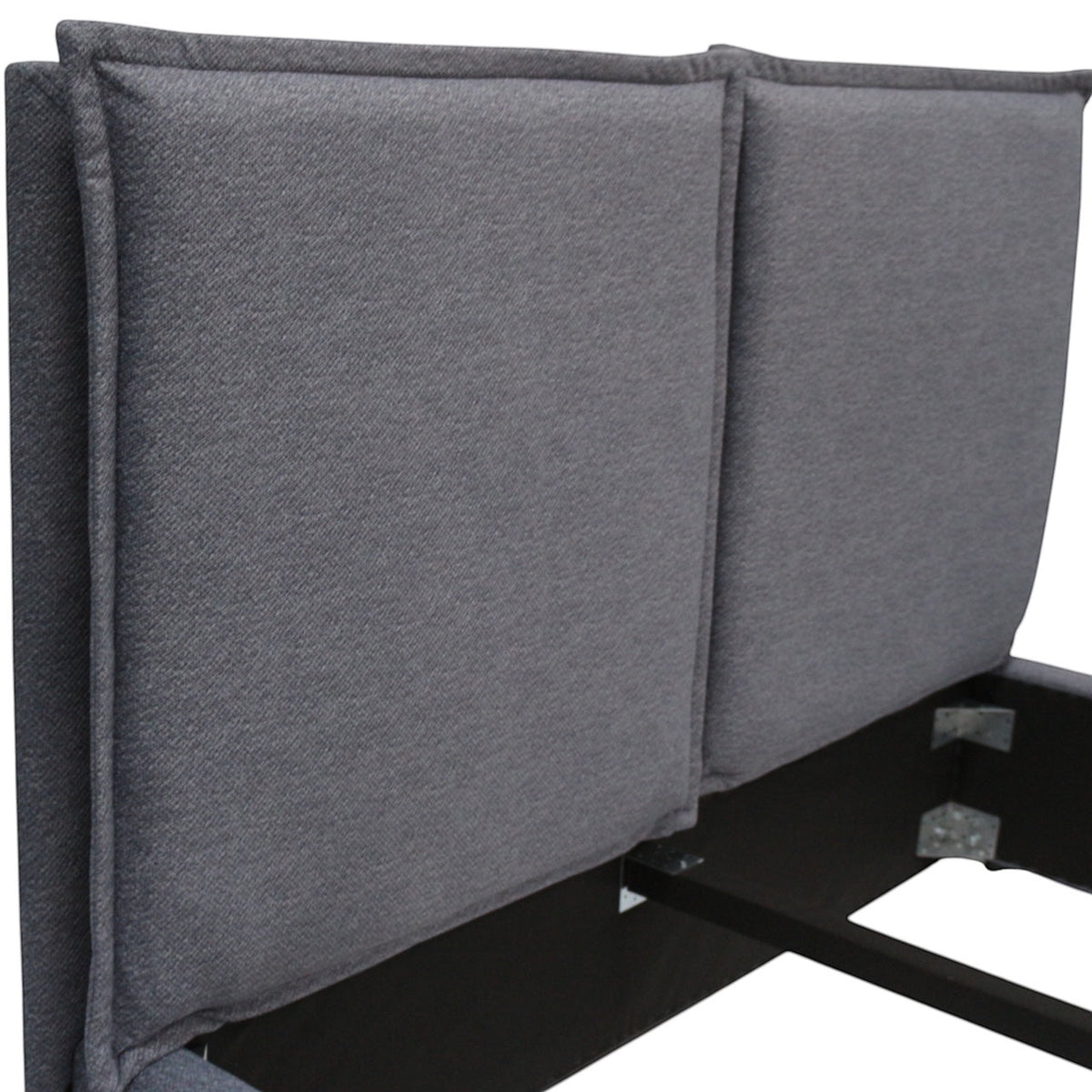 Close-up of the Vaya Home Elmon bed headboard showing grey upholstered panels and stitched edge detailing.