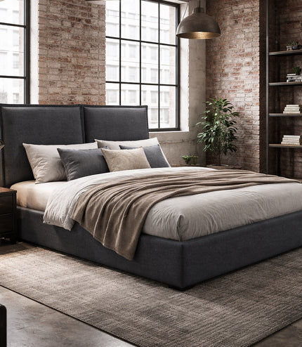 Vaya Home Elmon upholstered bed in grey fabric with a paneled headboard, styled in a modern bedroom.