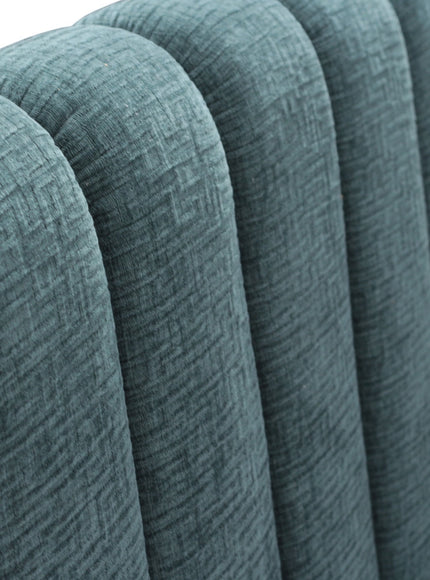 Close-up of the Vaya Home Elteo bench sofa showing blue textured upholstery and channel-tufted back detail.