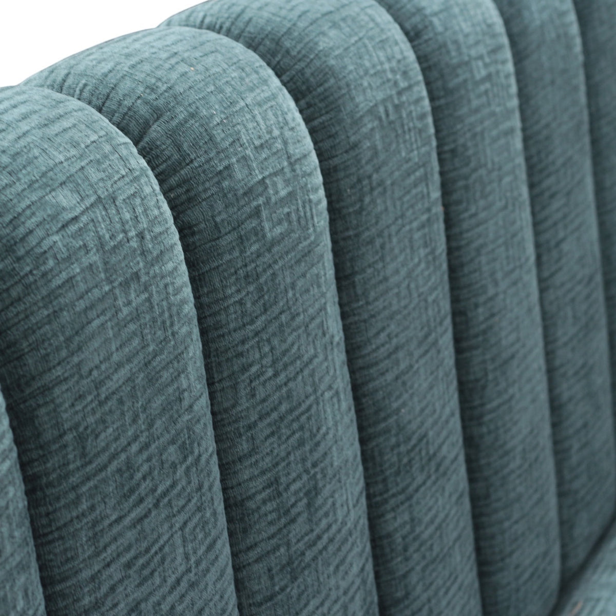 Close-up of the Vaya Home Elteo bench sofa showing blue textured upholstery and channel-tufted back detail.