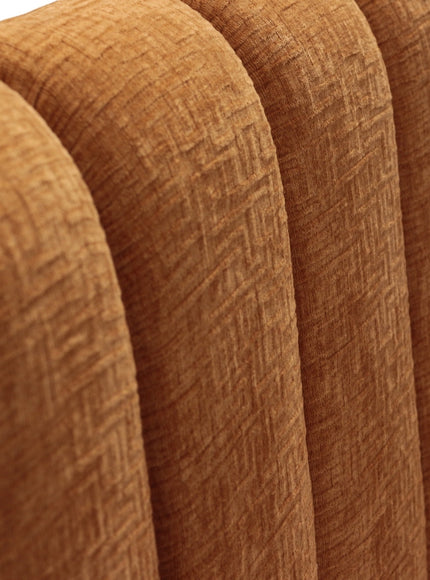 Close-up of the Vaya Home Elteo bench sofa showing orange textured upholstery and channel-tufted back detail.