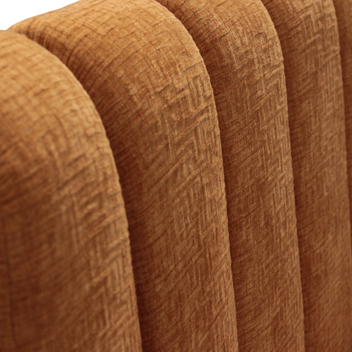 Close-up of the Vaya Home Elteo bench sofa showing orange textured upholstery and channel-tufted back detail.