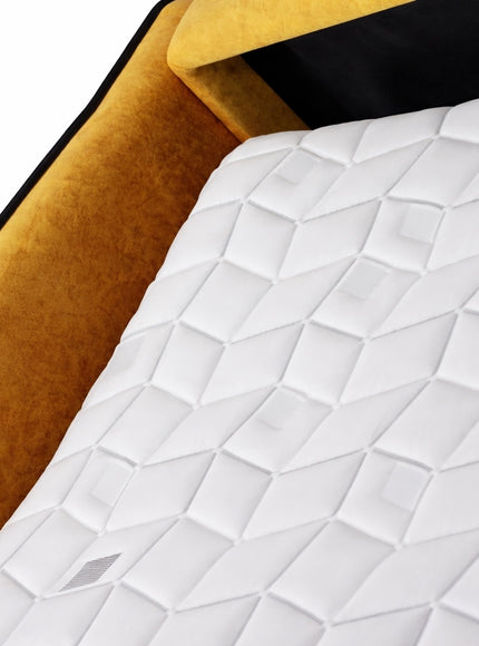 Close-up of the Vaya Home Fiorella sofa bed mattress and mustard velvet frame detail.