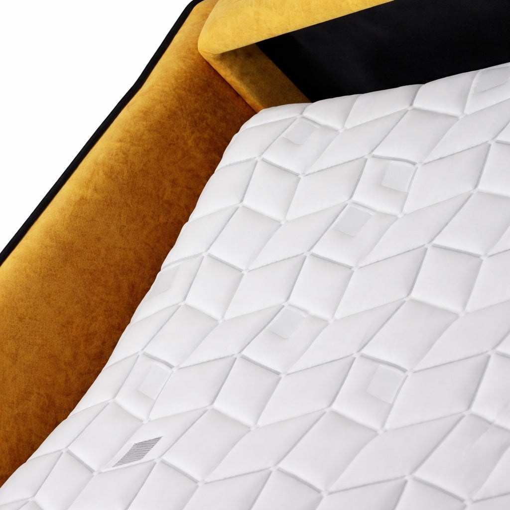 Close-up of the Vaya Home Fiorella sofa bed mattress and mustard velvet frame detail.