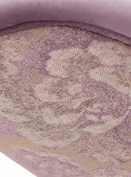Close-up of the Vaya Home Flora dining chair showing floral jacquard fabric detail and lilac upholstered trim.