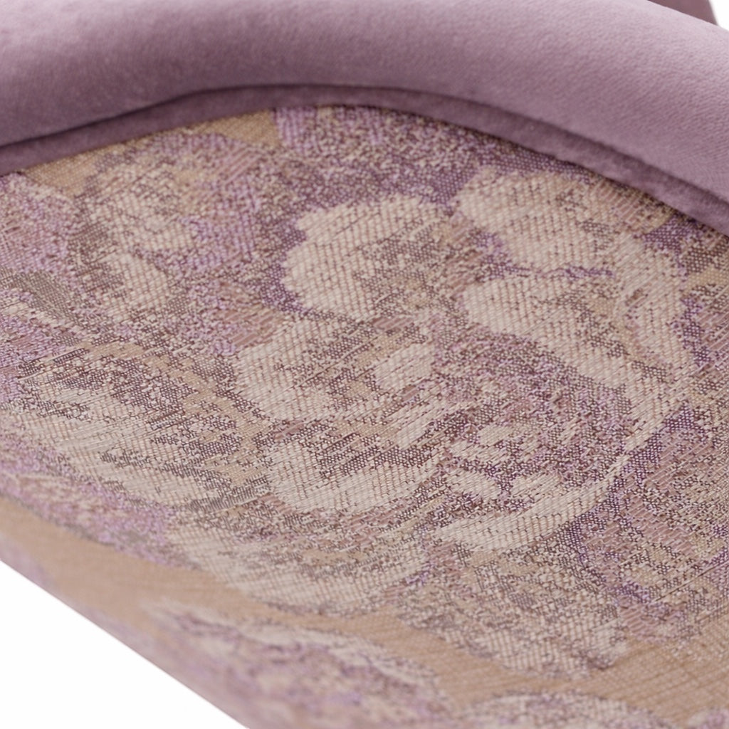 Close-up of the Vaya Home Flora dining chair showing floral jacquard fabric detail and lilac upholstered trim.