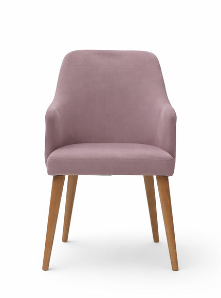Front view of the Vaya Home Flora dining chair with lilac upholstery, softly curved arms, and tapered wood legs.