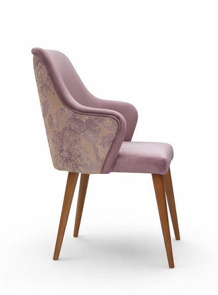 Side view of the Vaya Home Flora dining chair showing lilac upholstered arms, floral patterned outer back, and wood legs.