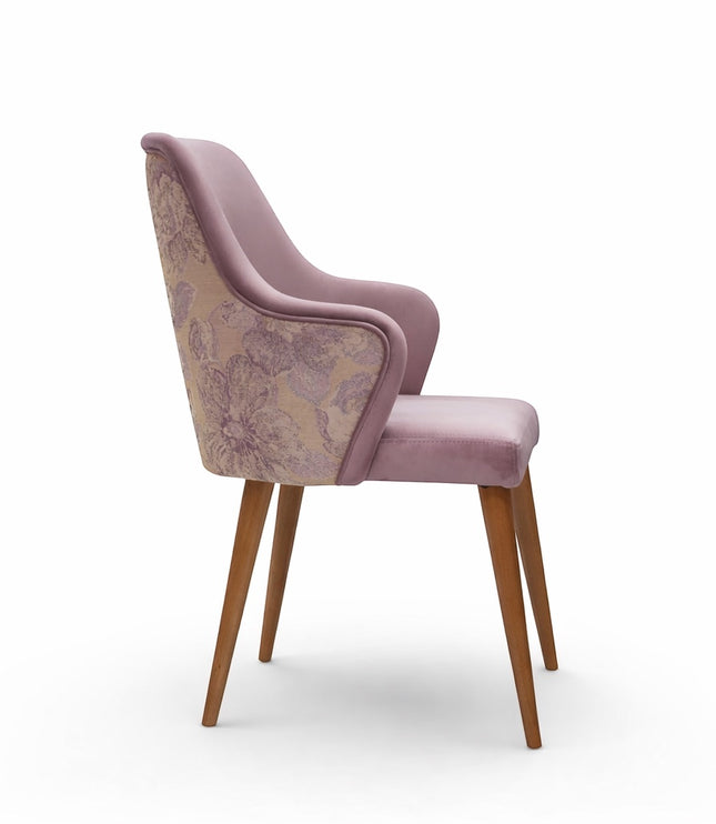 Side view of the Vaya Home Flora dining chair showing lilac upholstered arms, floral patterned outer back, and wood legs.