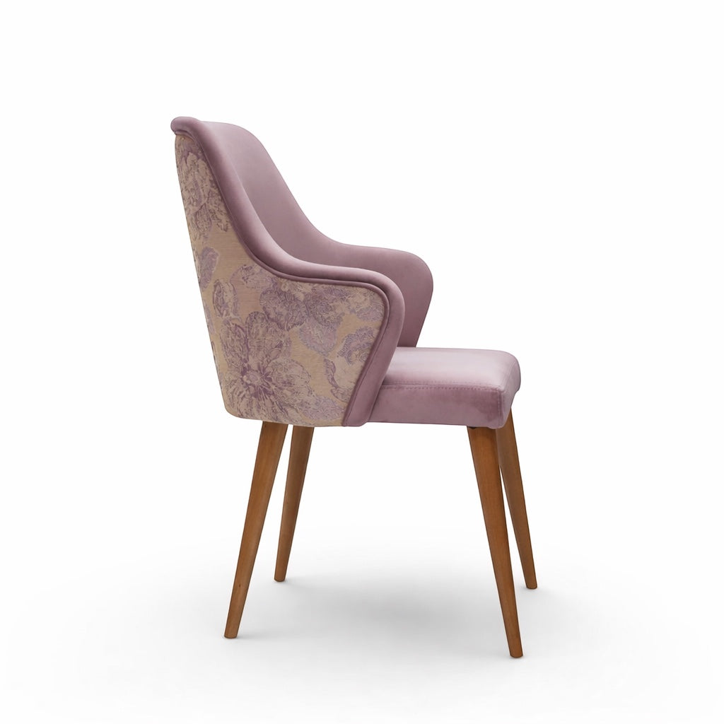 Side view of the Vaya Home Flora dining chair showing lilac upholstered arms, floral patterned outer back, and wood legs.