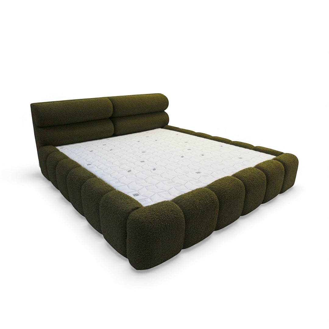 Vaya Home Forma bed in olive green upholstery with a low profile frame and padded channel-style detailing.