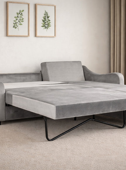 Vaya Home Grigio sectional sofa bed in gray upholstery, styled in a modern living room with chaise extension.