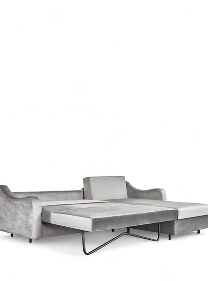 Angled view of the Vaya Home Grigio sleeper sectional in gray upholstery with chaise section and extended bed platform.
