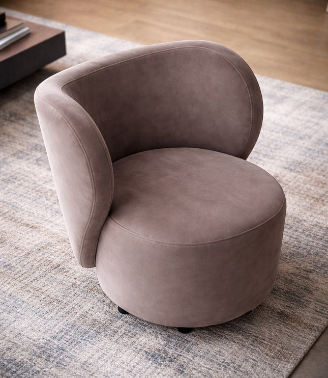 Angled view of the Vaya Home Halo accent chair with taupe upholstery, rounded seat, and sculptural curved backrest.