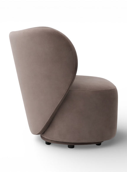 Profile view of the Vaya Home Halo accent chair with a rounded seat base and sweeping curved backrest in taupe upholstery.
