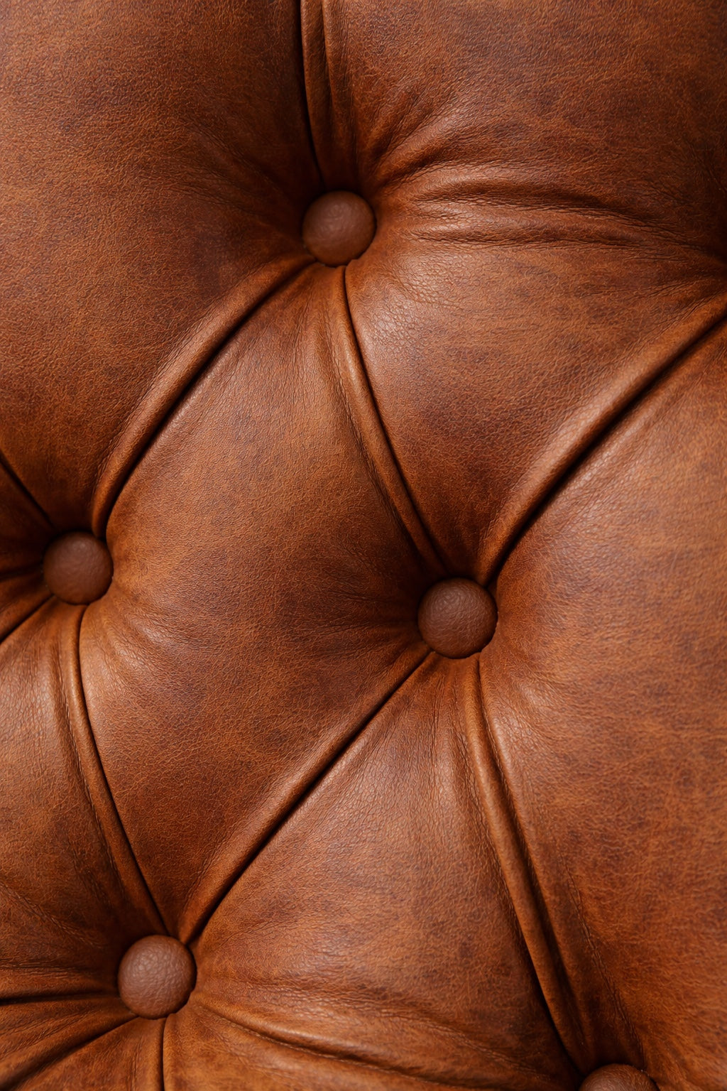 Close-up of the Vaya Home Hudson dining chair showing brown faux leather upholstery and button-tufted detailing.